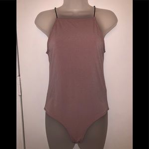 Sleeveless mauve body suit